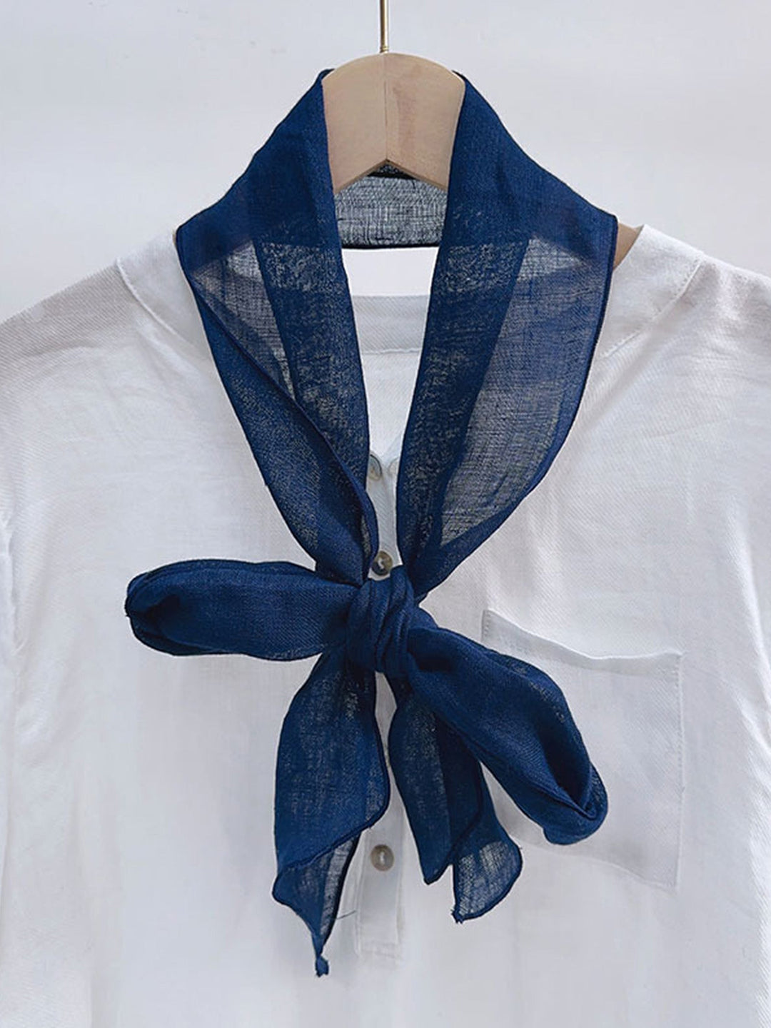 Linen scarf featuring a hand tie-dye finish in various colors, showcasing a soft and lightweight design perfect for year-round wear. 4