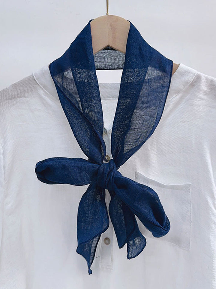 Linen scarf featuring a hand tie-dye finish in various colors, showcasing a soft and lightweight design perfect for year-round wear. 4