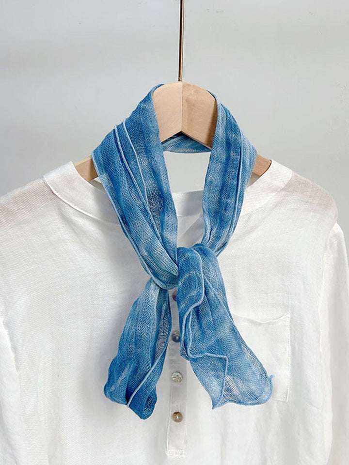 Linen scarf featuring a hand tie-dye finish in various colors, showcasing a soft and lightweight design perfect for year-round wear. 6