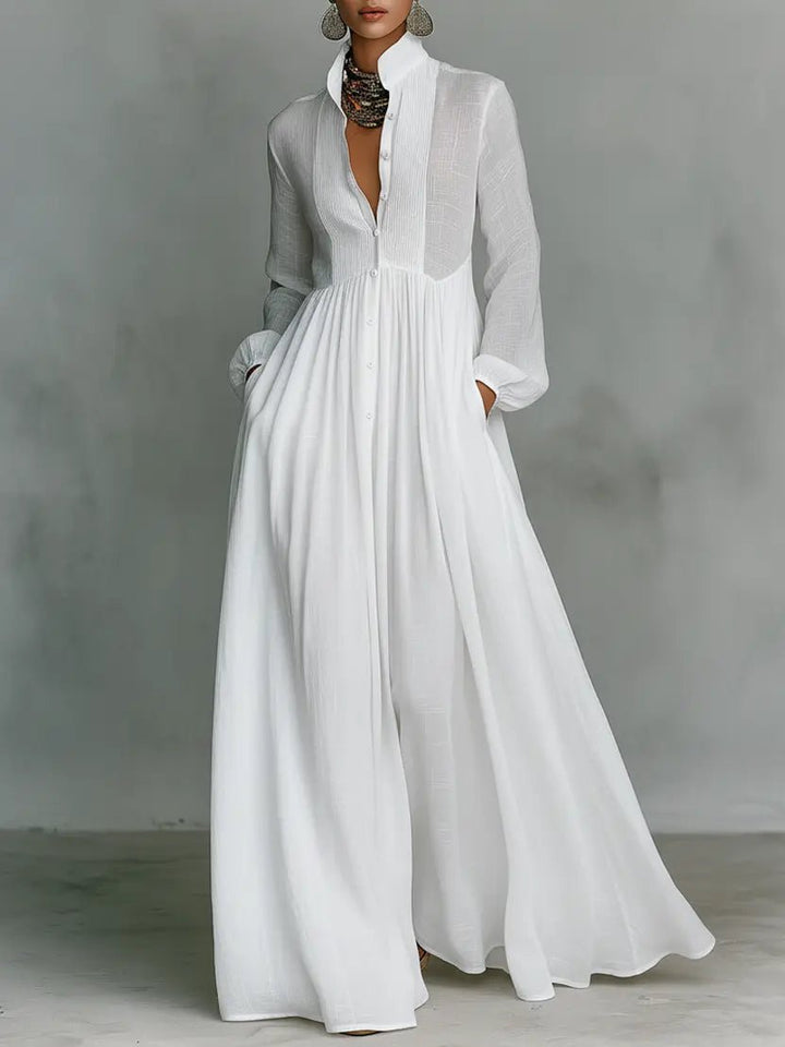 Elegant maxi dress featuring patchwork linen design, stand-up collar, and button closure, perfect for sophisticated occasions. 0
