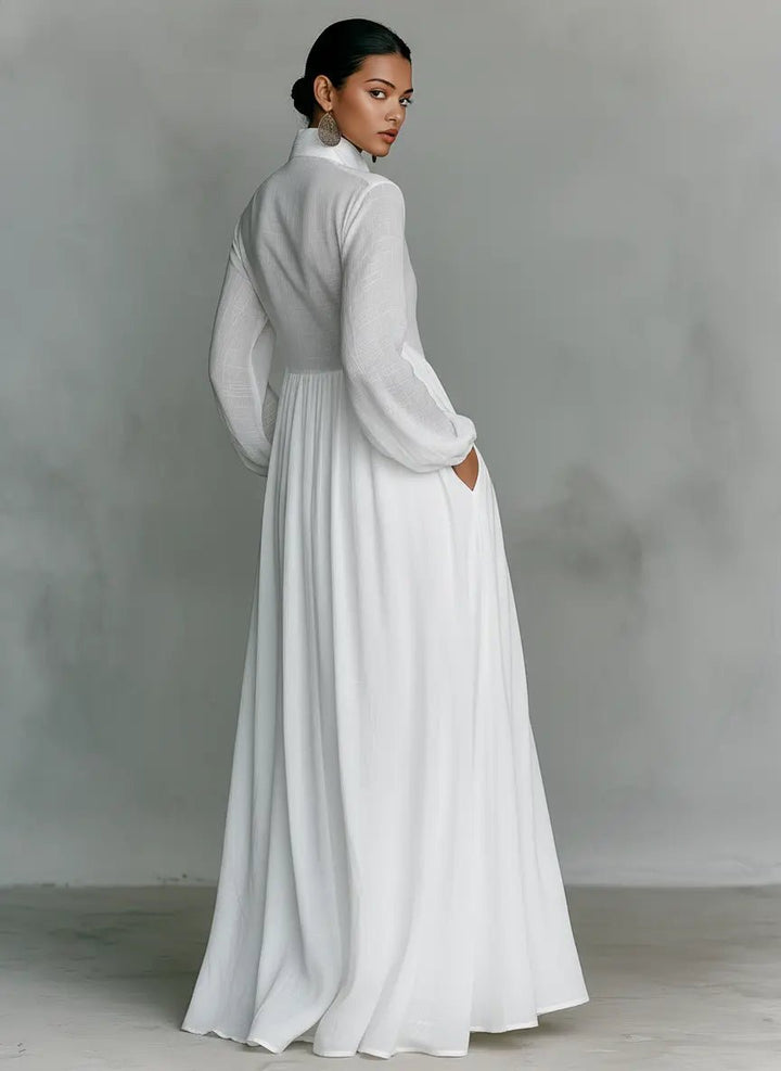 Elegant maxi dress featuring patchwork linen design, stand-up collar, and button closure, perfect for sophisticated occasions. 1