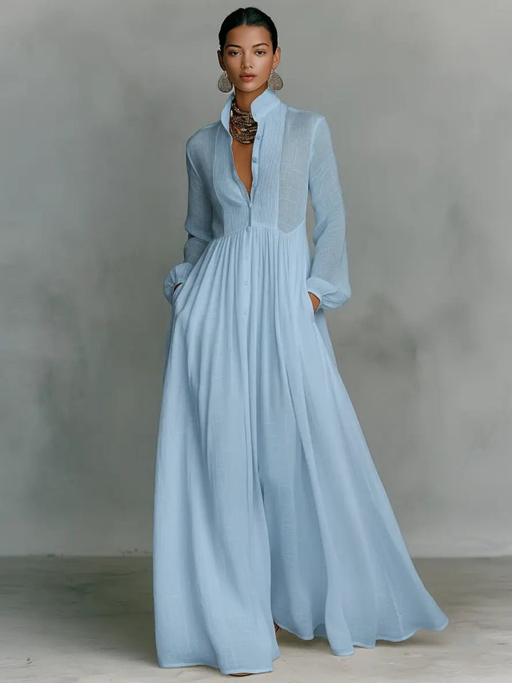 Elegant maxi dress featuring patchwork linen design, stand-up collar, and button closure, perfect for sophisticated occasions. 2