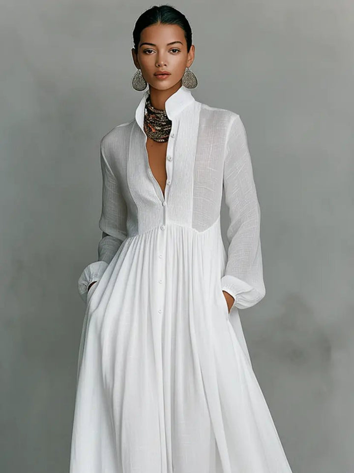 Elegant maxi dress featuring patchwork linen design, stand-up collar, and button closure, perfect for sophisticated occasions. 4