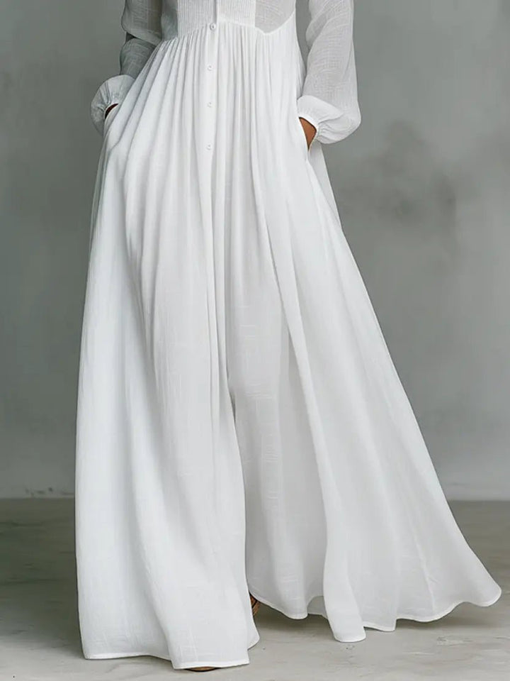 Elegant maxi dress featuring patchwork linen design, stand-up collar, and button closure, perfect for sophisticated occasions. 5