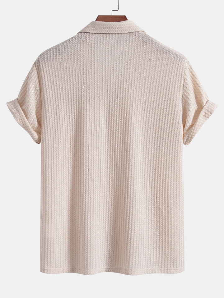 Men's outfit set featuring a textured knitted waffle shirt paired with lightweight linen pants, ideal for casual summer style. 5