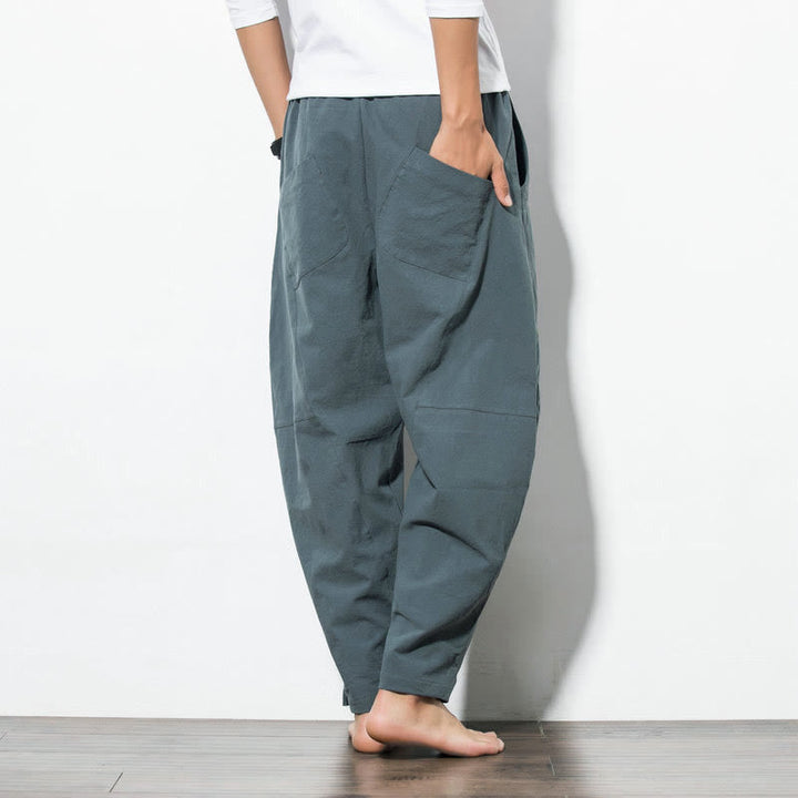 Men's casual tapered fit cotton joggers with drawstring and pockets, available in solid colors, perfect for everyday wear. 2