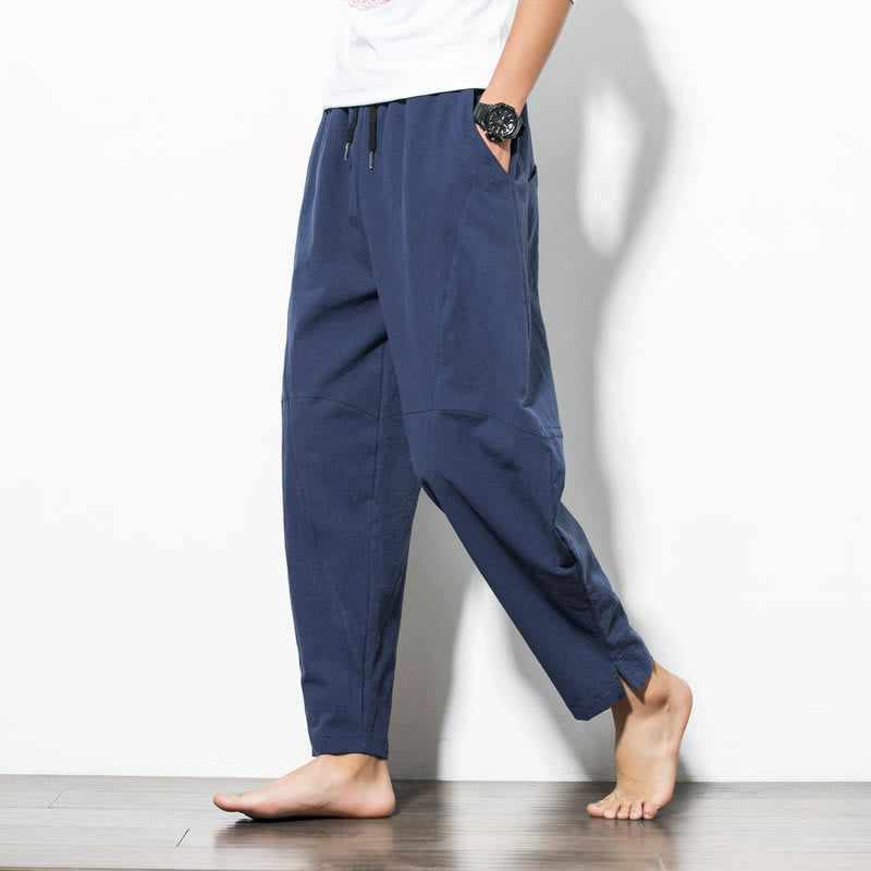 Men's casual tapered fit cotton joggers with drawstring and pockets, available in solid colors, perfect for everyday wear. 9