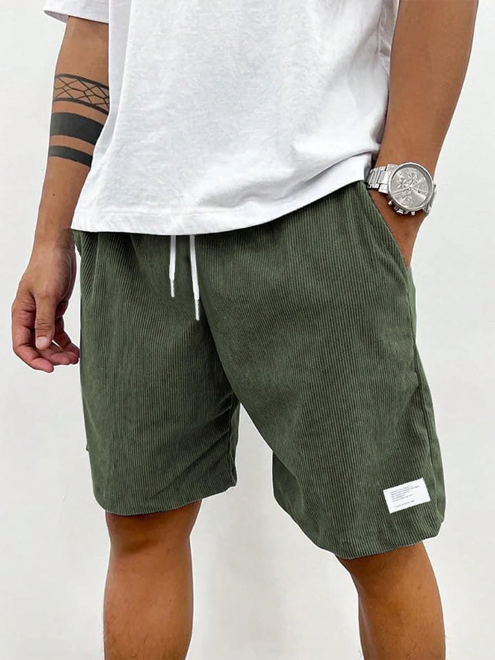 Men's shorts featuring an adjustable drawstring, designed for a casual and lightweight fit, perfect for summer comfort and outdoor activities. 0
