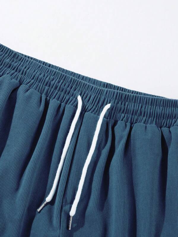Men's shorts featuring an adjustable drawstring, designed for a casual and lightweight fit, perfect for summer comfort and outdoor activities. 3