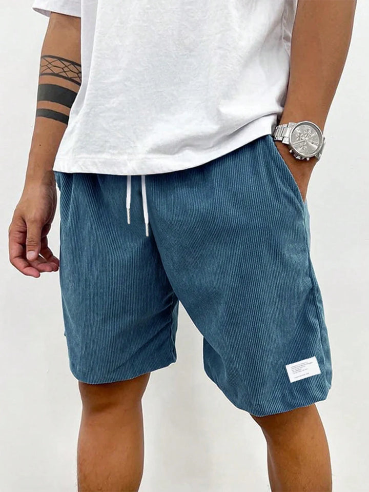 Men's shorts featuring an adjustable drawstring, designed for a casual and lightweight fit, perfect for summer comfort and outdoor activities. 4