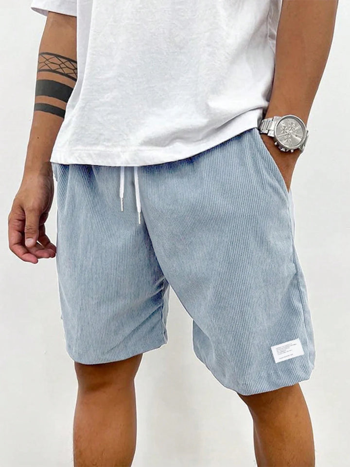 Men's shorts featuring an adjustable drawstring, designed for a casual and lightweight fit, perfect for summer comfort and outdoor activities. 9