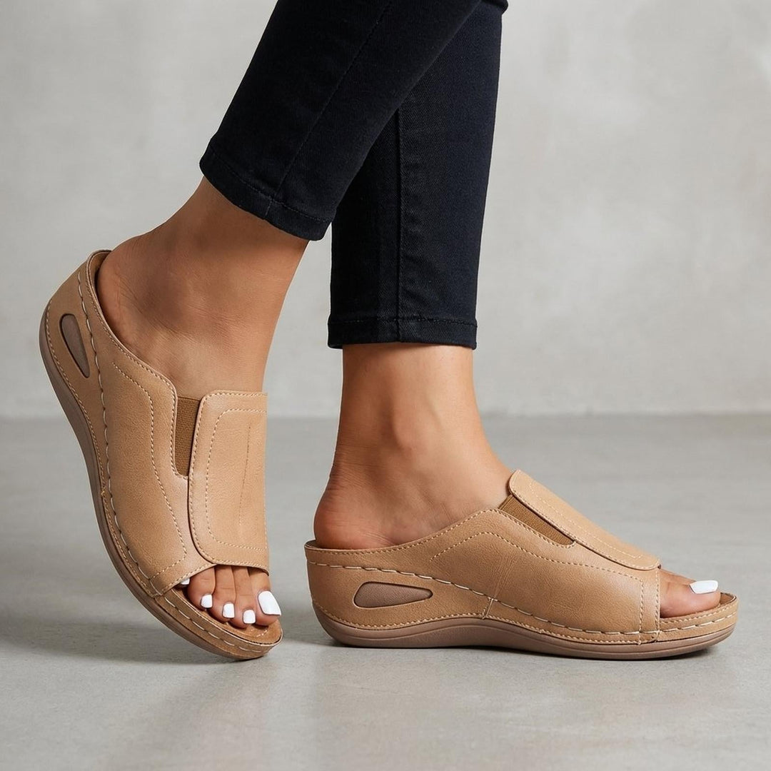 Orthopedic wedge sandals for women featuring arch support, slip-on design, and open-toe style in durable leather. 0