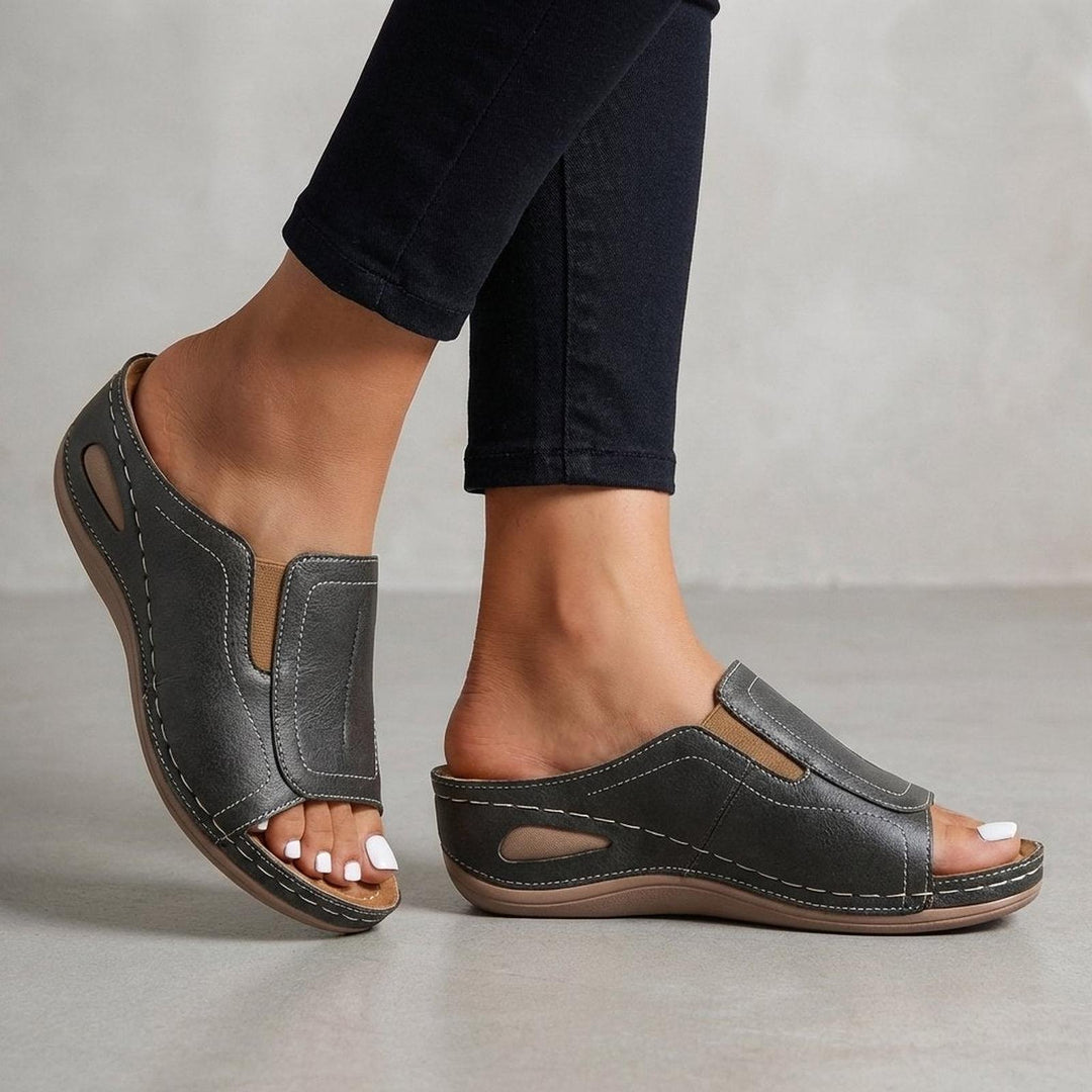 Orthopedic wedge sandals for women featuring arch support, slip-on design, and open-toe style in durable leather. 1