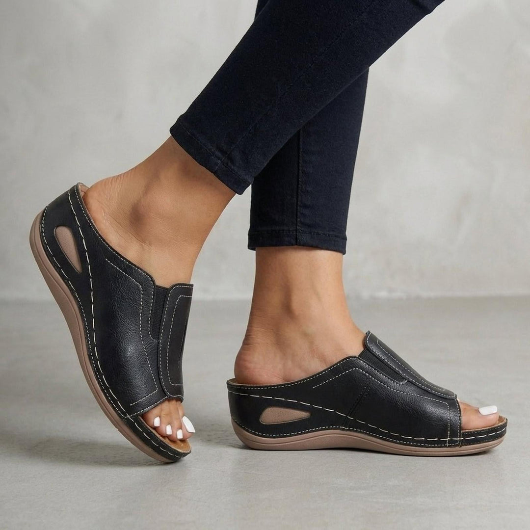 Orthopedic wedge sandals for women featuring arch support, slip-on design, and open-toe style in durable leather. 2