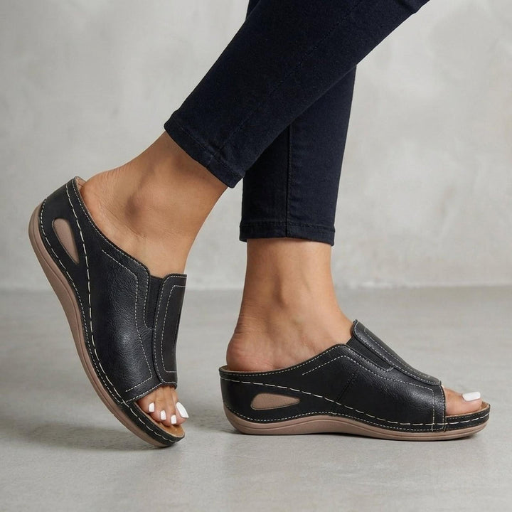 Orthopedic wedge sandals for women featuring arch support, slip-on design, and open-toe style in durable leather. 2