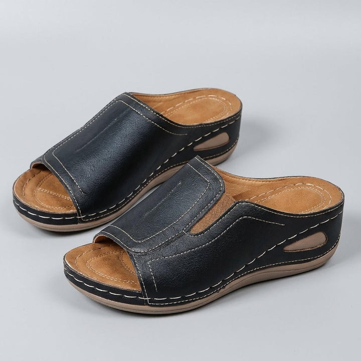 Orthopedic wedge sandals for women featuring arch support, slip-on design, and open-toe style in durable leather. 4