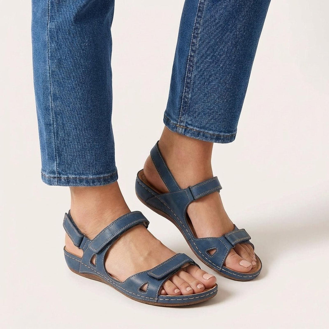 Orthopedic women's sandals featuring an adjustable strap and open-toe design, designed for comfort and support for all-day wear. 0