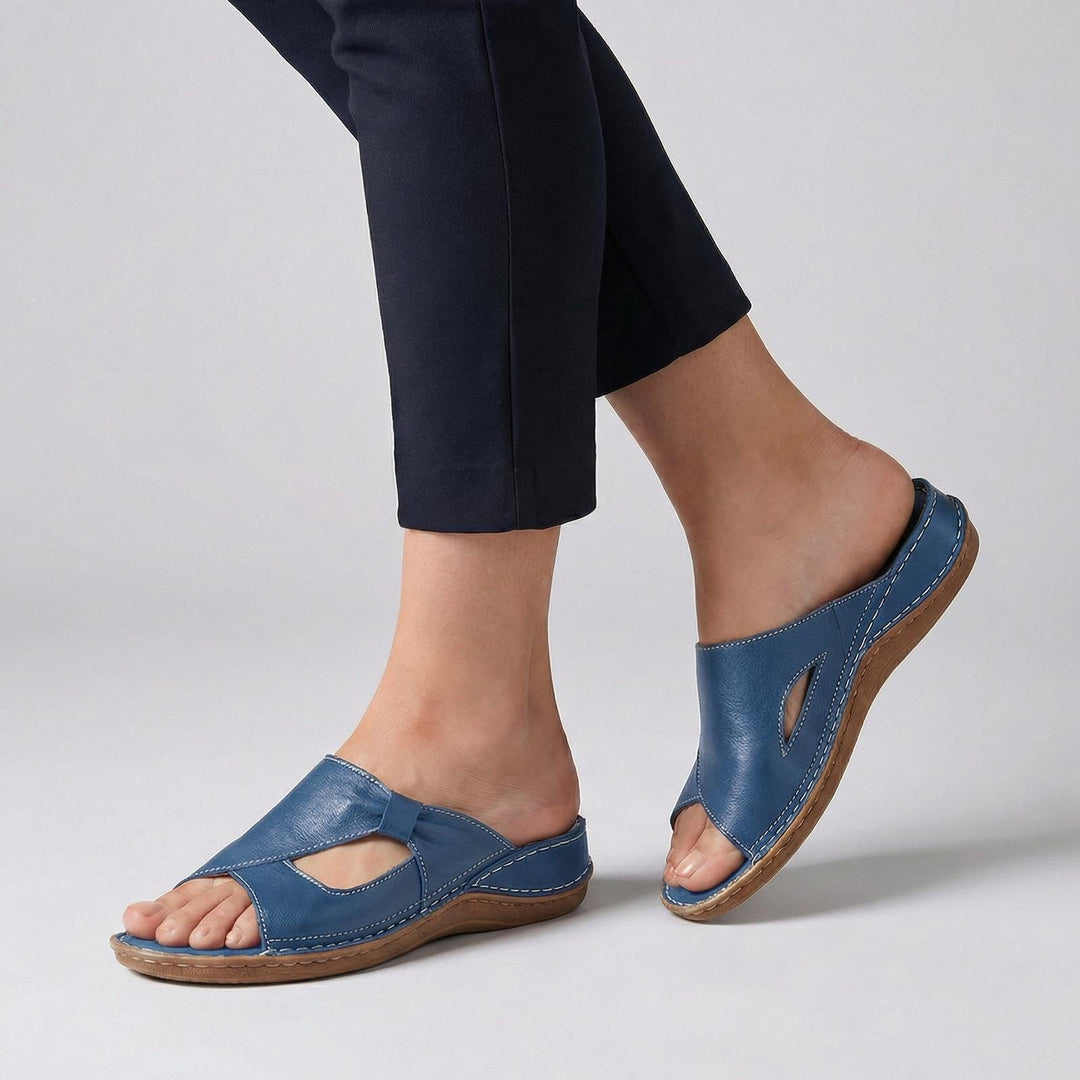 Orthopedic women's sandals featuring arch support, made of premium leather with a slip-on open toe design, ideal for comfort and style. 1