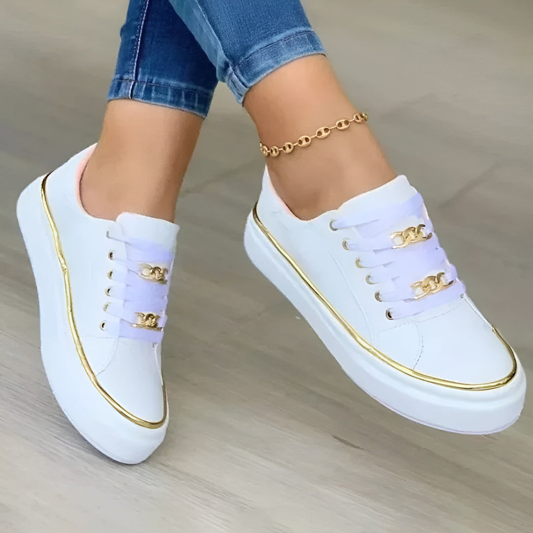 Orthopedic women's sneakers featuring shock-absorbing soles and stylish golden accents, perfect for comfort and fashionable everyday wear. 0