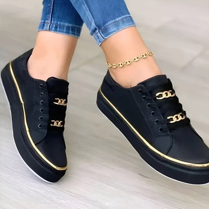 Orthopedic women's sneakers featuring shock-absorbing soles and stylish golden accents, perfect for comfort and fashionable everyday wear. 2
