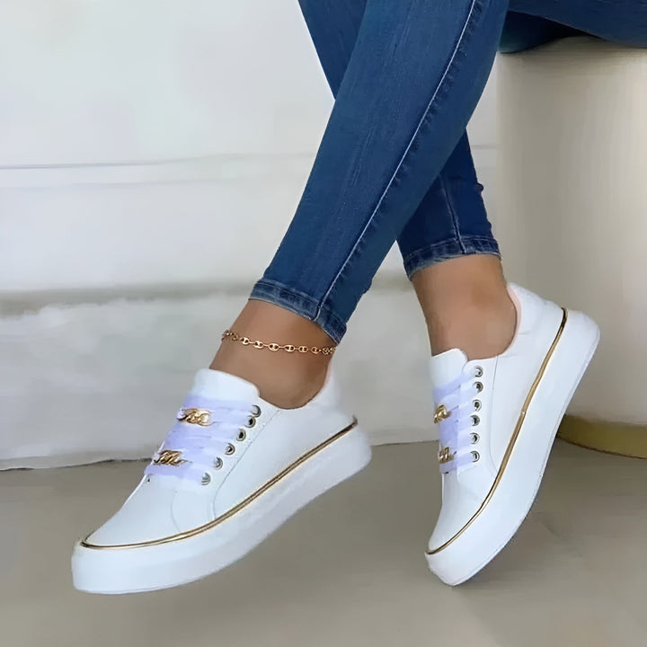 Orthopedic women's sneakers featuring shock-absorbing soles and stylish golden accents, perfect for comfort and fashion. 3