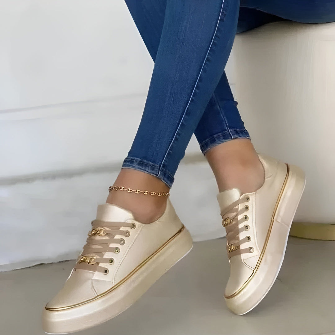 Orthopedic women's sneakers featuring shock-absorbing soles and stylish golden accents, perfect for comfort and fashionable everyday wear. 4