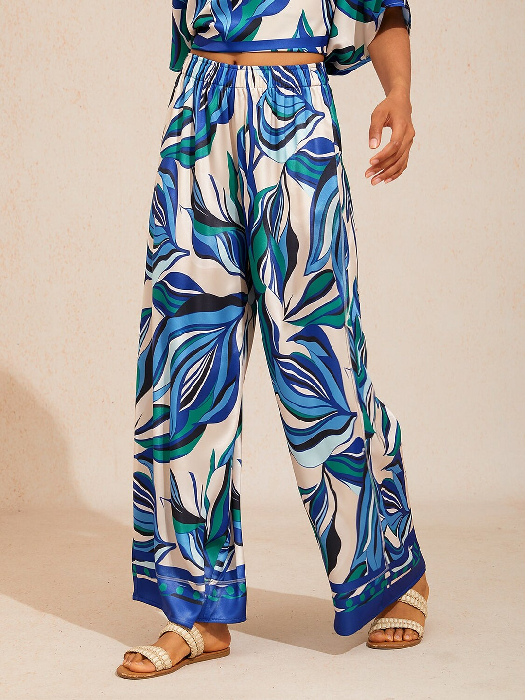 Satin wide leg pants featuring a floral motif and elastic waistband, designed for a flowy relaxed fit, perfect for women's casual and chic outfits. 16