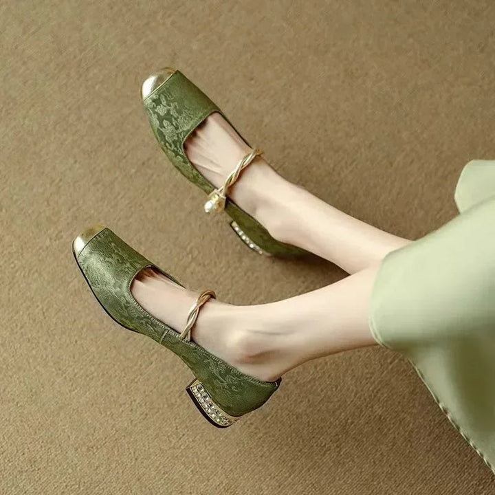 Elegant silk-like evening pumps featuring a pearl strap and embellished square heel, perfect for formal occasions. 1