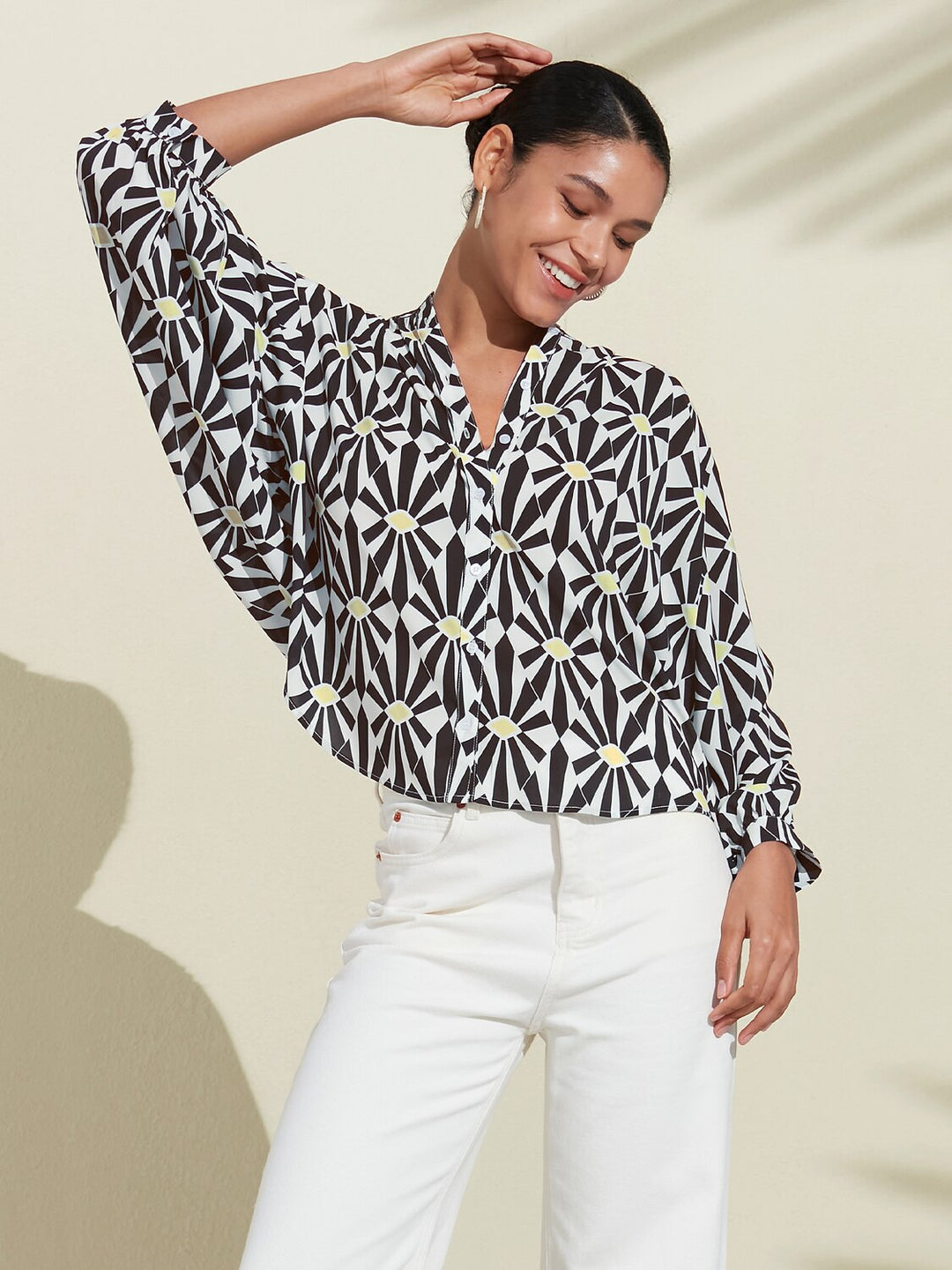 Silky satin blouse featuring a vibrant Moroccan floral print, designed with a relaxed fit, button-down front, and long sleeves for a stylish and comfortable look 0