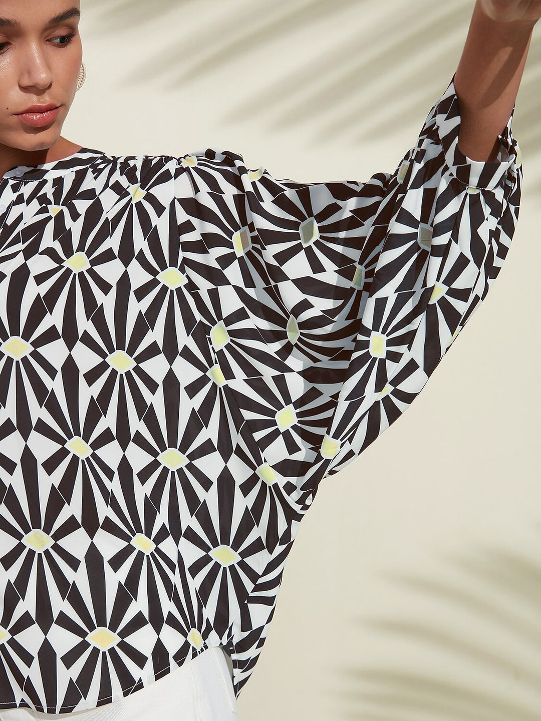 Silky satin blouse featuring a vibrant Moroccan floral print, designed with a relaxed fit, button-down front, and long sleeves for a stylish and comfortable look 2
