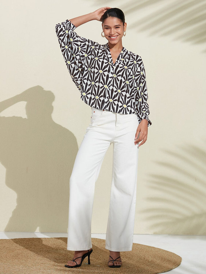 Silky satin blouse featuring a vibrant Moroccan floral print, designed with a relaxed fit, button-down front, and long sleeves for a stylish and comfortable look 4