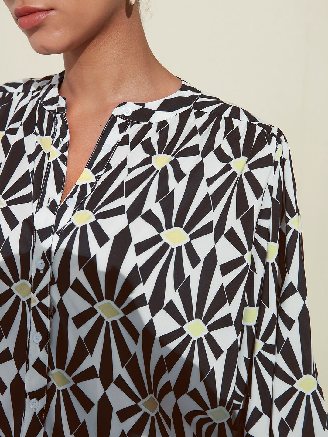 Silky satin blouse featuring a vibrant Moroccan floral print, designed with a relaxed fit, button-down front, and long sleeves for a stylish and comfortable look 7
