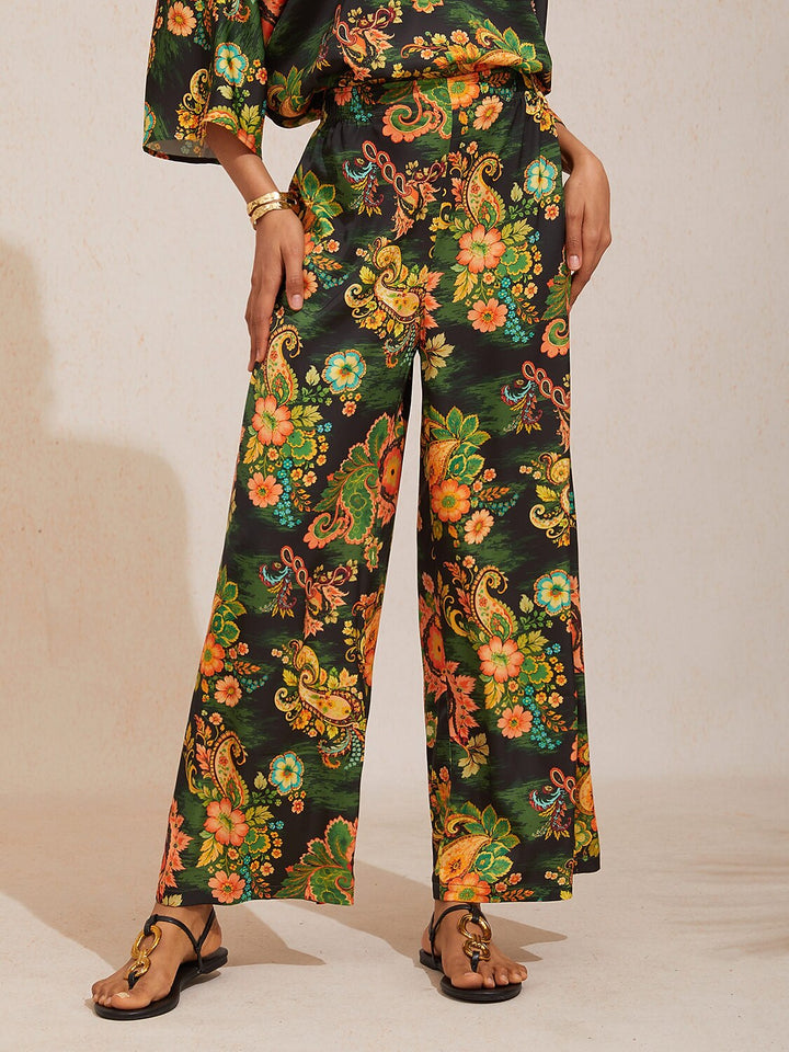 Silky satin women's pants in Mediterranean blue featuring a gold-chain print and an elastic waistband, designed in a stylish straight-leg cut. 14