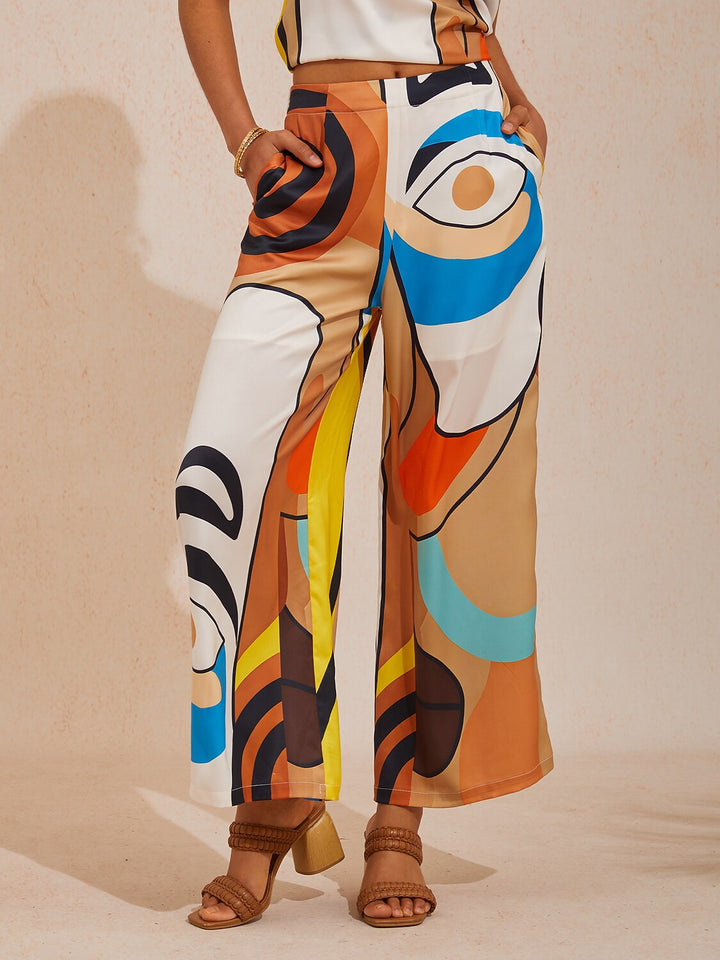 Silky satin women's pants in Mediterranean blue featuring a gold-chain print and an elastic waistband, designed in a stylish straight-leg cut. 5