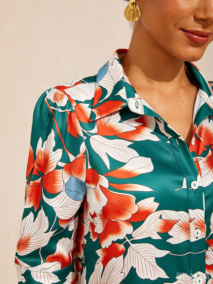 Silky satin shirt dress for women featuring a vibrant floral design in deep green hibiscus, offering a relaxed fit and tropical style perfect for summer outings. 5