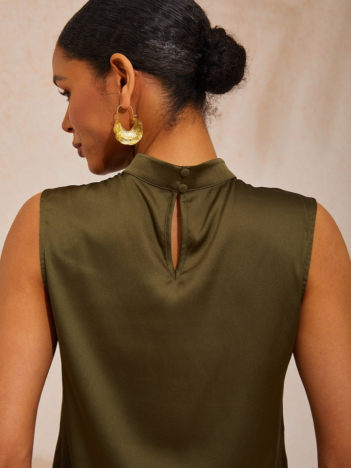 Silky satin sleeveless top with mock neck, featuring an elegant design for ladies, ideal for resort dinners and weekend brunches. 1