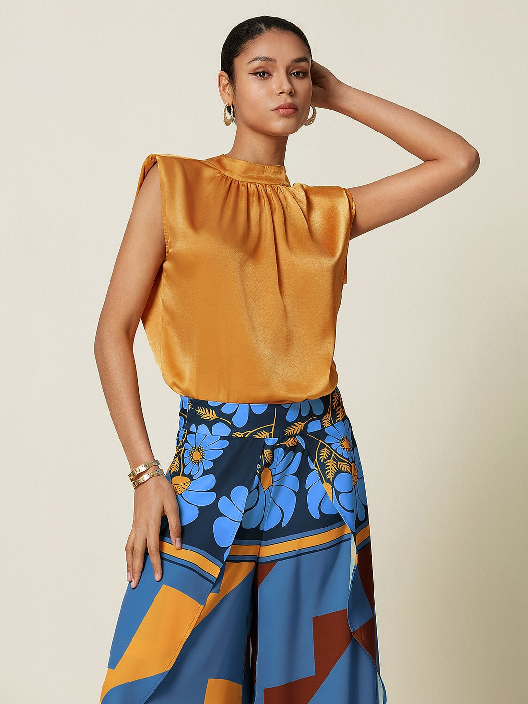 Silky satin sleeveless top with mock neck, featuring an elegant design for ladies, ideal for resort dinners and weekend brunches. 11