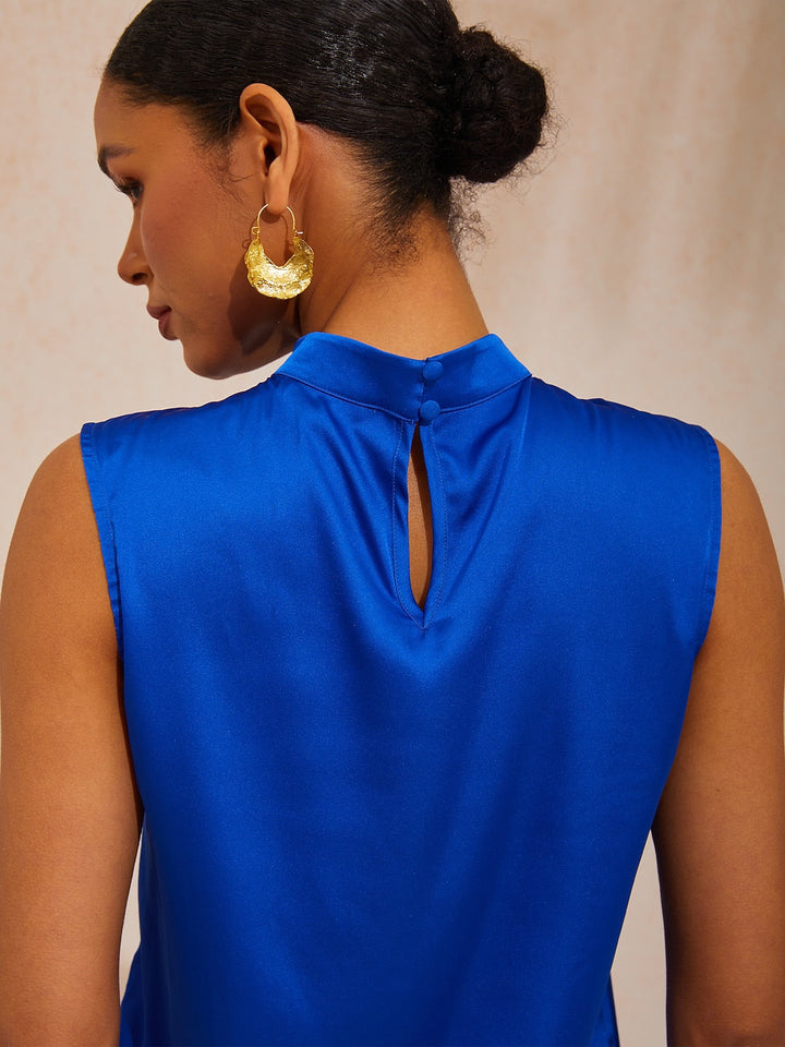 Silky satin sleeveless top with mock neck, featuring an elegant design for ladies, ideal for resort dinners and weekend brunches. 7