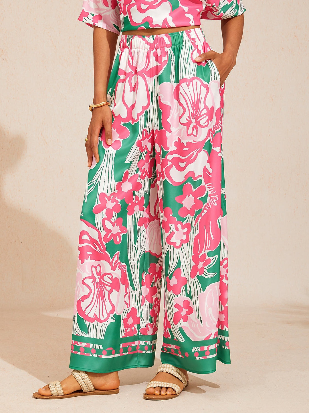 Silky satin wide leg pants featuring an elastic waist and vibrant tropical print, designed for a flowy relaxed fit for women. 10