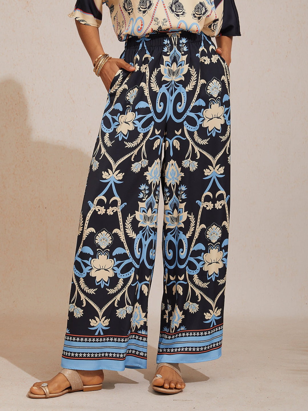 Silky satin wide leg pants featuring an elastic waist and vibrant tropical print, designed for a flowy relaxed fit for women. 13