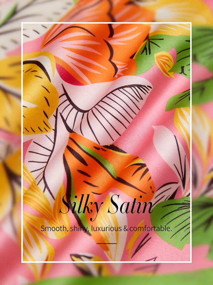 Silky satin wide leg pants featuring an elastic waist and vibrant tropical print, designed for a flowy relaxed fit for women. 2