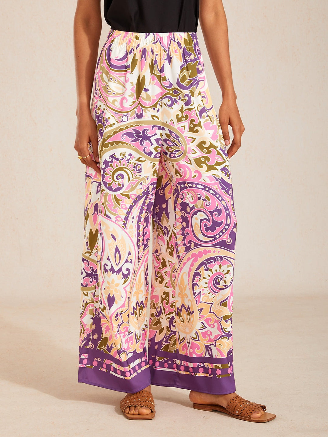 Silky satin wide leg pants featuring an elastic waist and vibrant tropical print, designed for a flowy relaxed fit for women. 9
