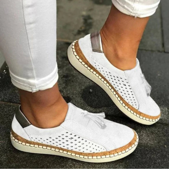 Slip on shoes featuring arch support and a breathable knit upper, designed for lightweight comfort and non-slip traction on all terrains. 2