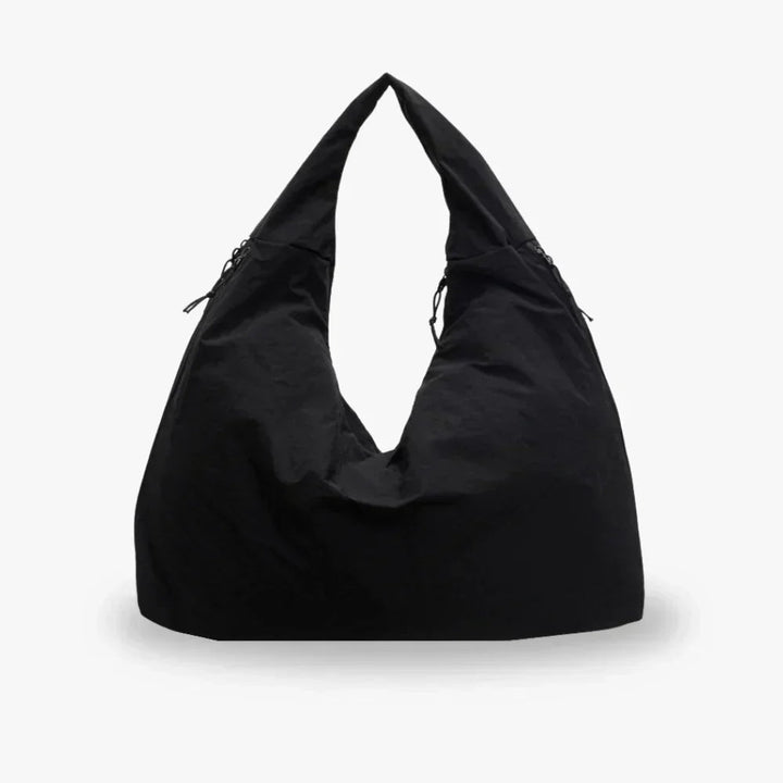 Slouchy hobo shoulder bag with adjustable toggles, large everyday tote for women in stylish design and versatile colors. 0