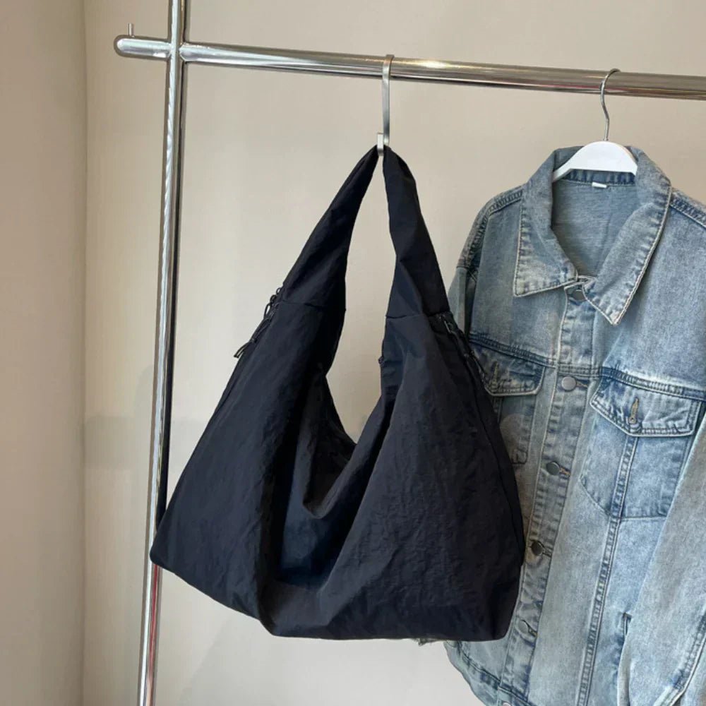 Slouchy hobo shoulder bag with adjustable toggles, large everyday tote for women in stylish design and versatile colors. 1