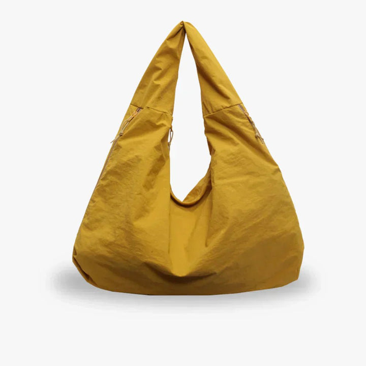Slouchy hobo shoulder bag with adjustable toggles, large everyday tote for women in stylish design and versatile colors. 10