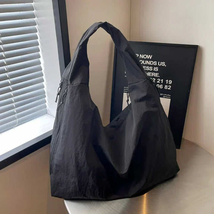 Slouchy hobo shoulder bag with adjustable toggles, large everyday tote for women in stylish design and versatile colors. 2