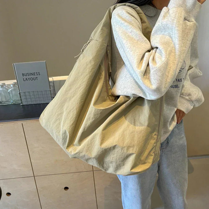 Slouchy hobo shoulder bag with adjustable toggles, large everyday tote for women in stylish design and versatile colors. 8