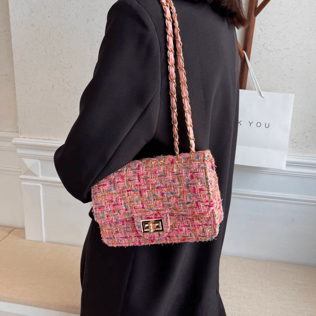 Structured shoulder bag featuring a stylish bouclé exterior and a chic chain strap, designed for women seeking elegance in everyday accessories. 2