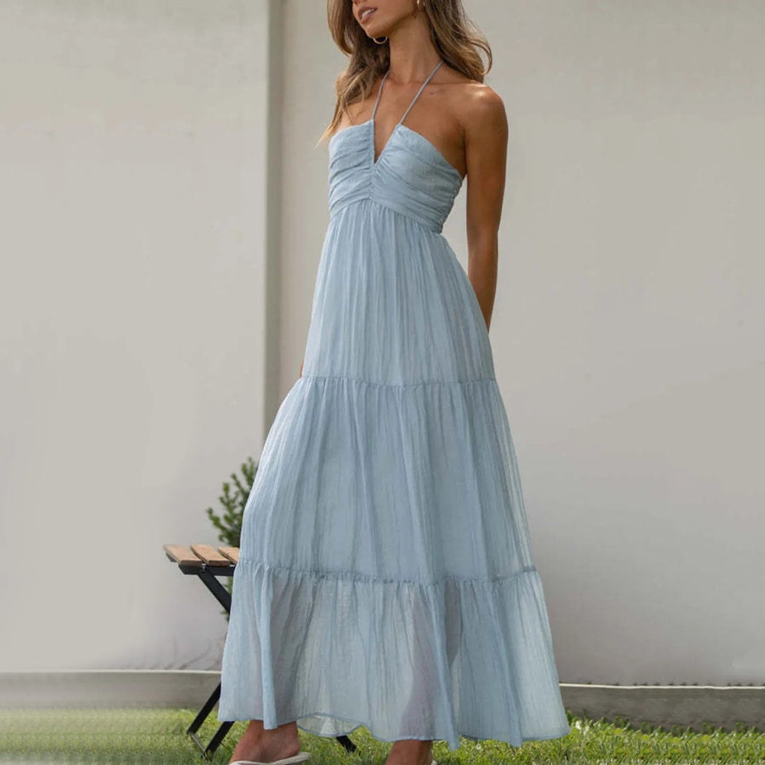 Tiered maxi dress featuring an adjustable halter neckline, made from lightweight breathable fabric, perfect for both casual and formal occasions. 0